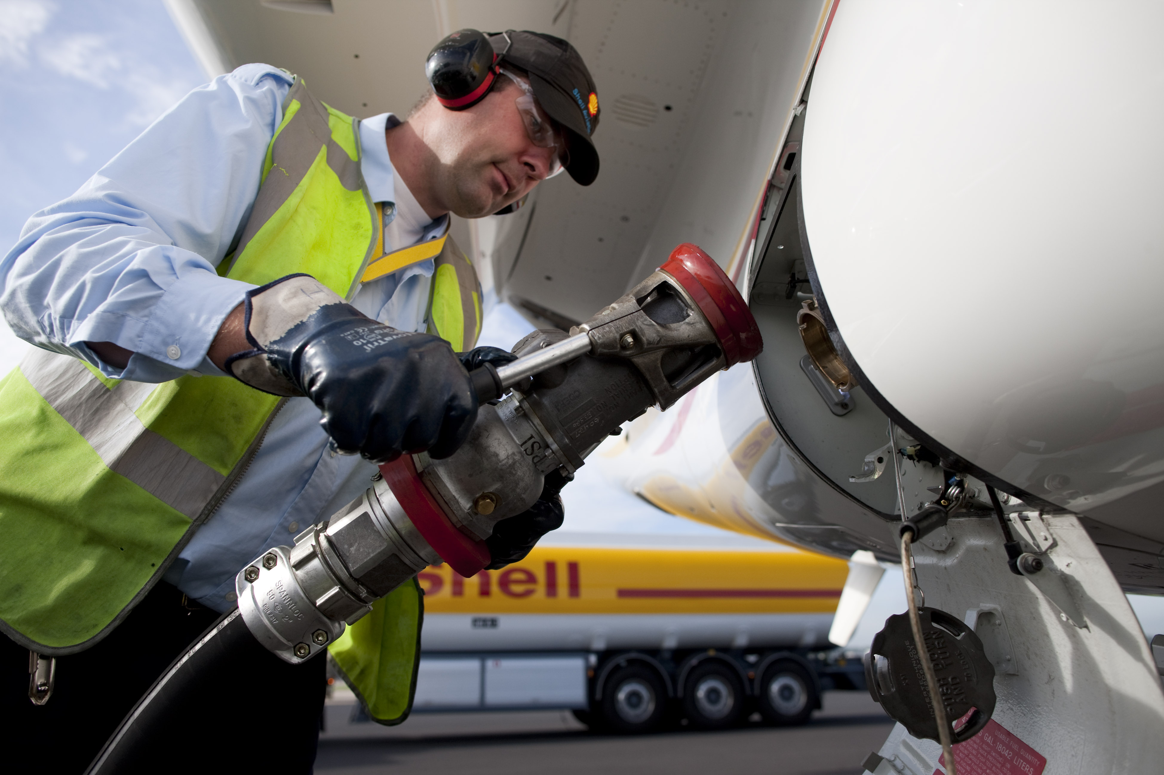 Shell Aviation crew fueling an aircraft with into-plane service
